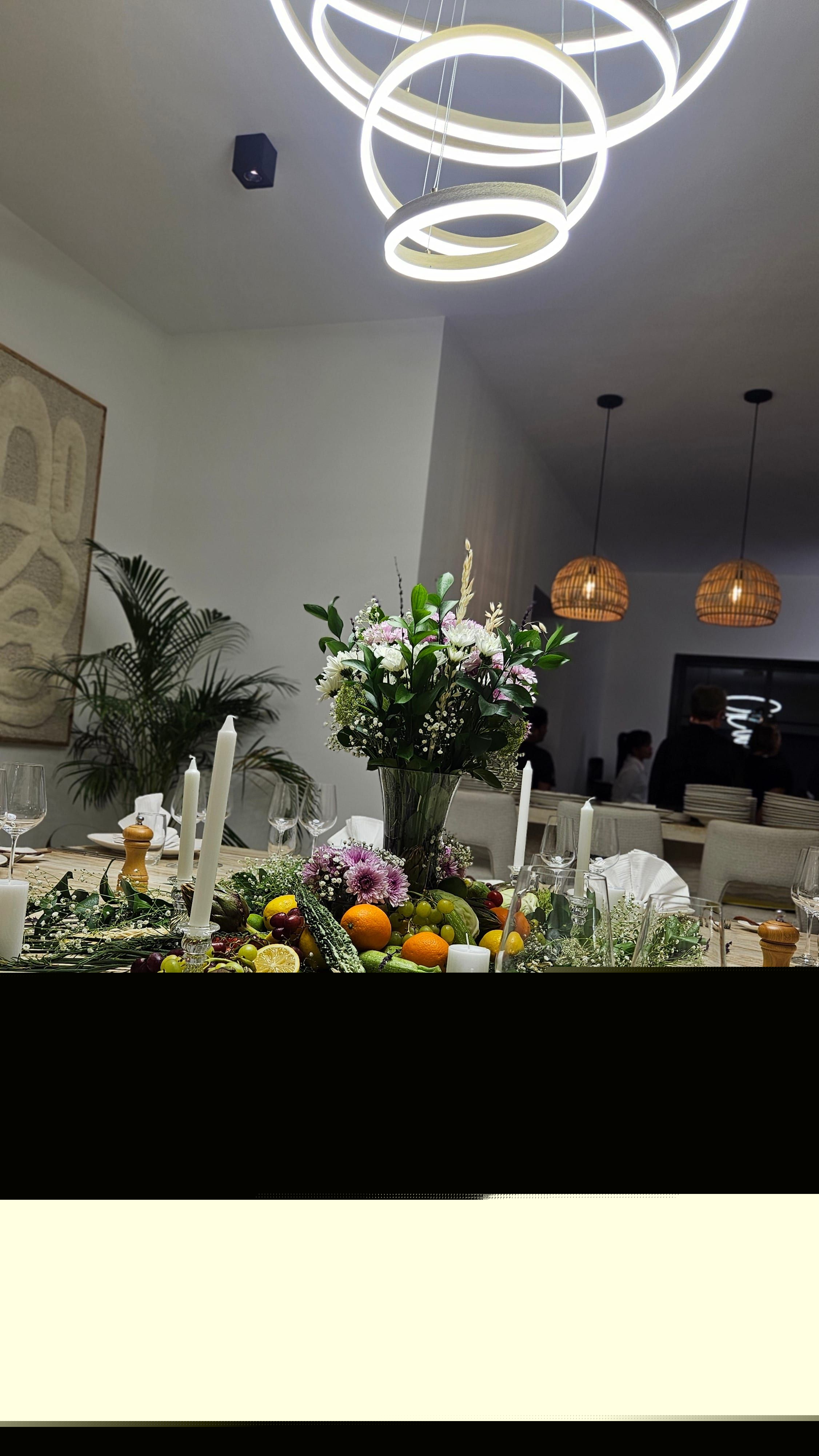 A dining table dressed for the evening in Abu Dhabi, glasses and linen set.