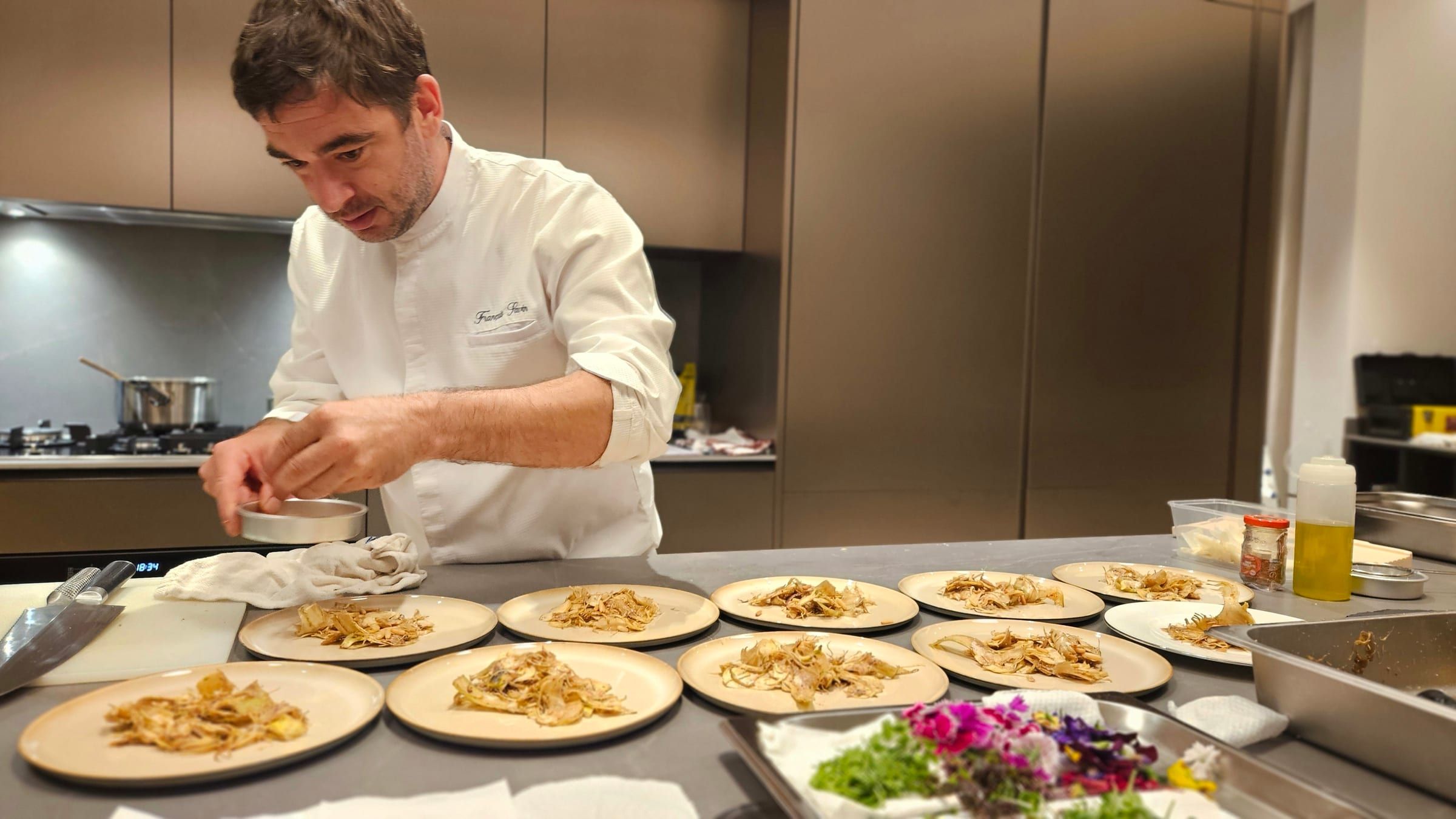 Chef Savin plating a course on site at a private dinner in Dubai
