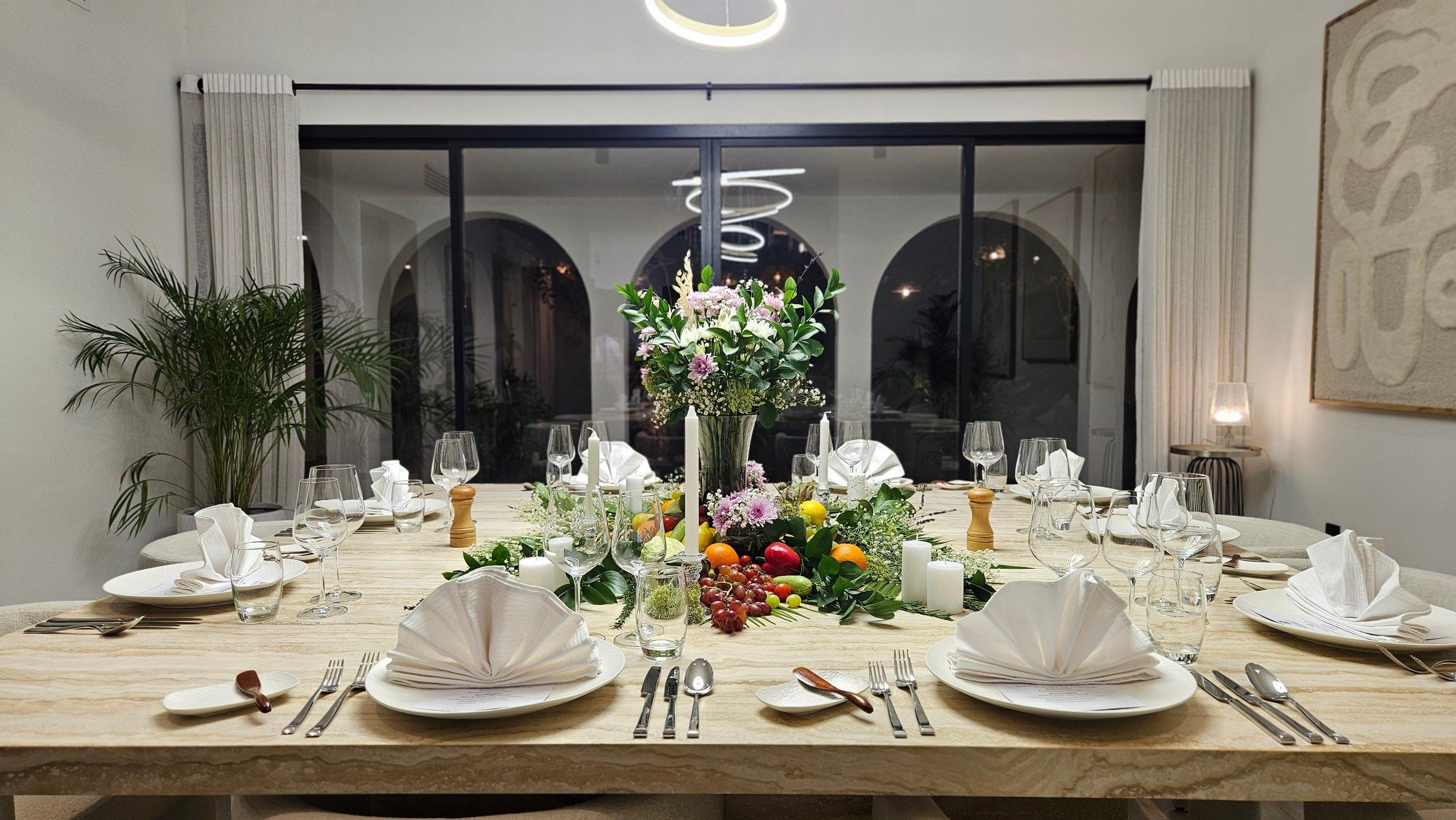 A long banquet table dressed for a private event