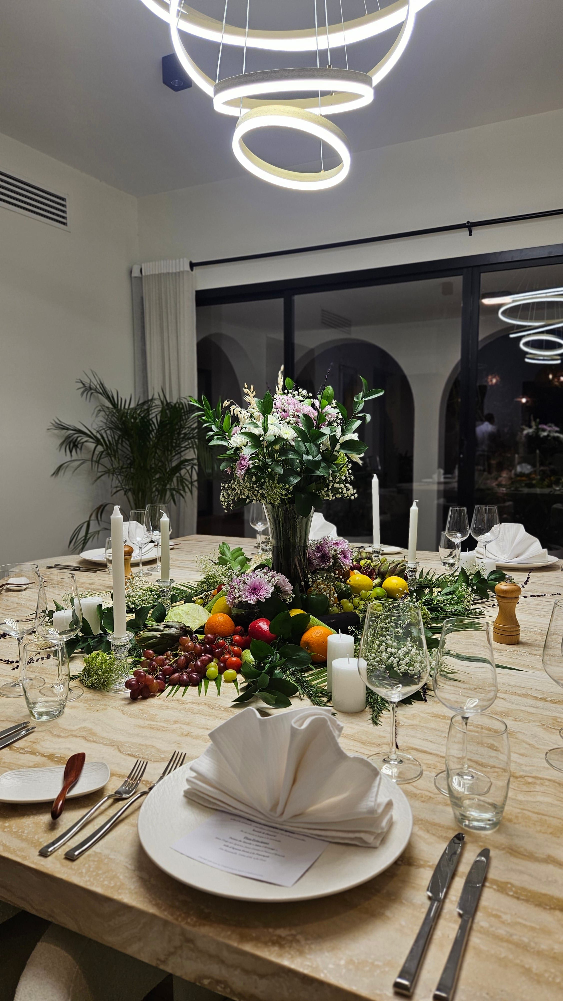 A dining table dressed for a private dinner on Jumeirah Bay.