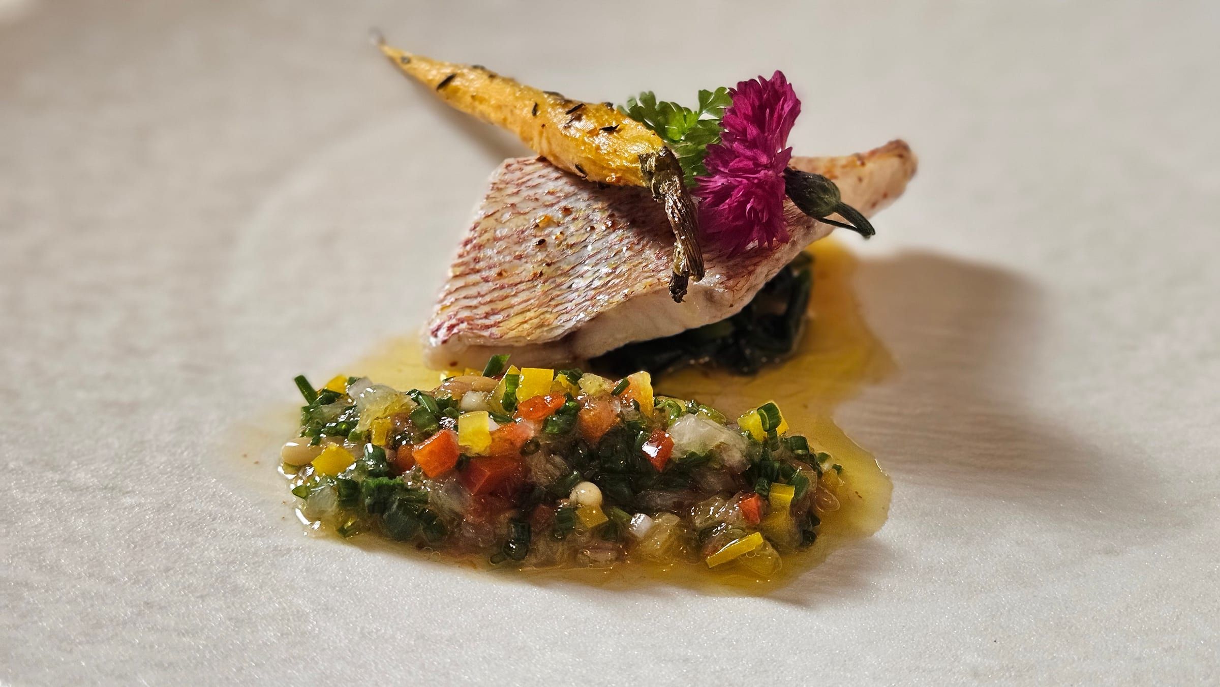 A signature fish course from the chef’s menu, plated to order.