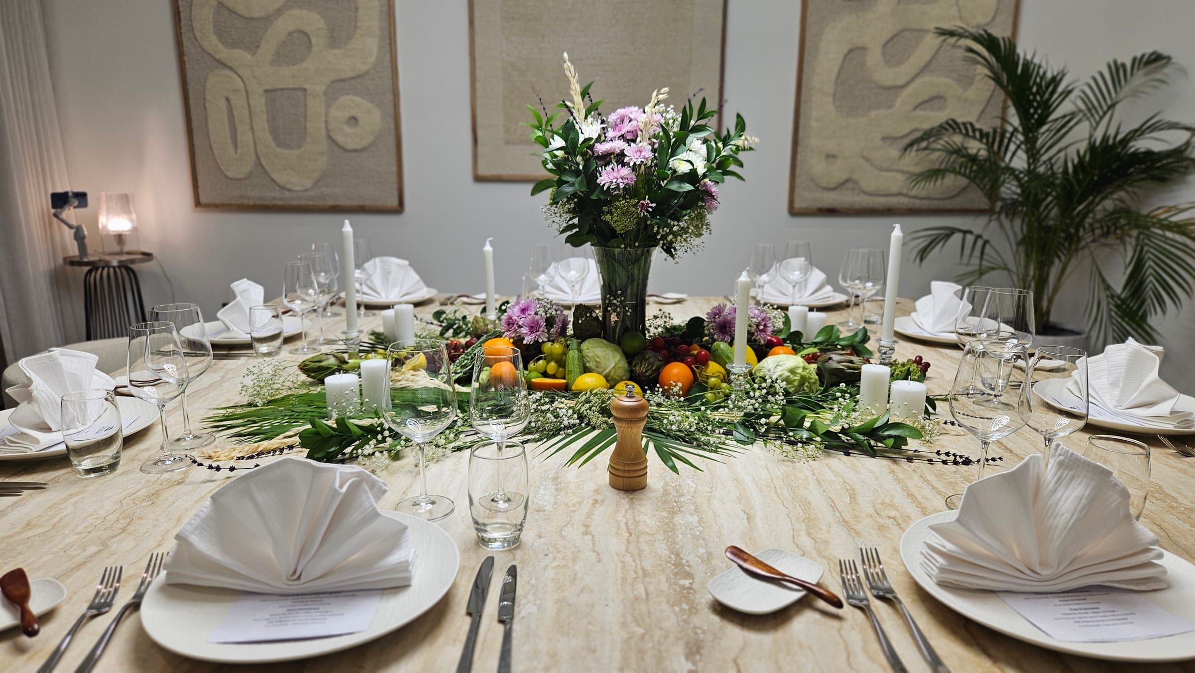 A dressed dining table on Palm Jumeirah, glasses and flowers ready for guests.