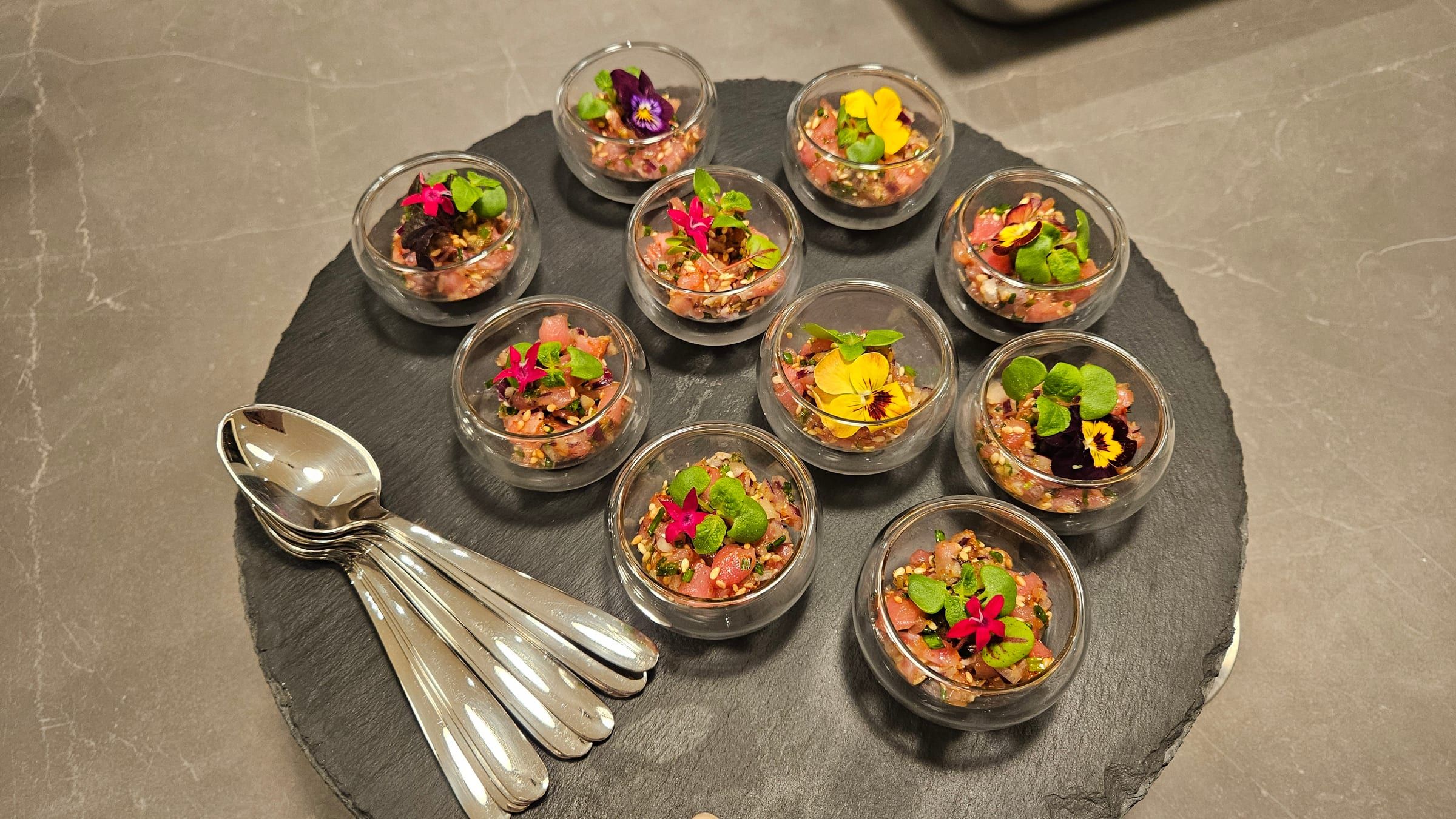 Canapé verrines lined up for an iftar gathering.