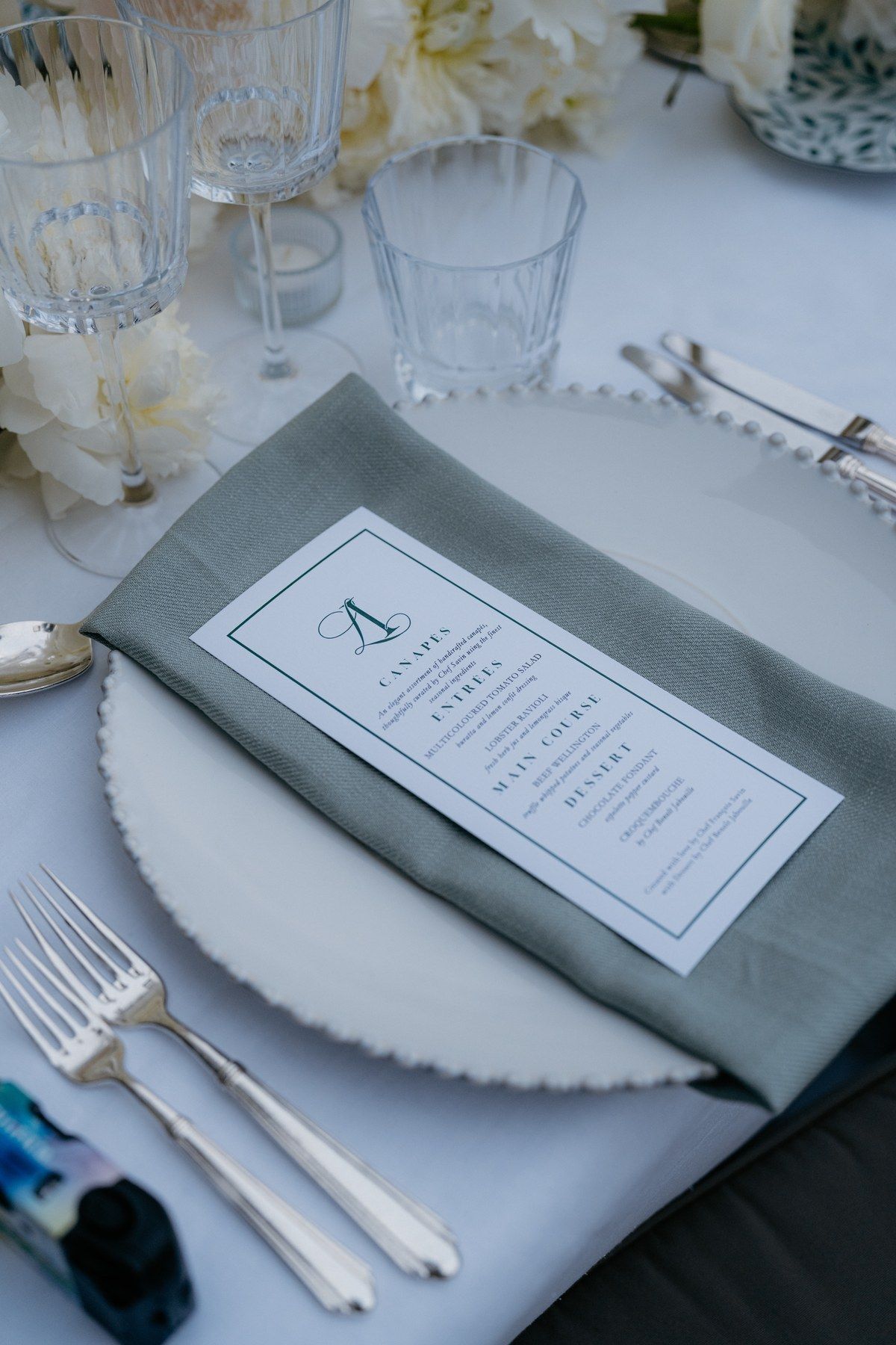Place setting with a printed menu card.