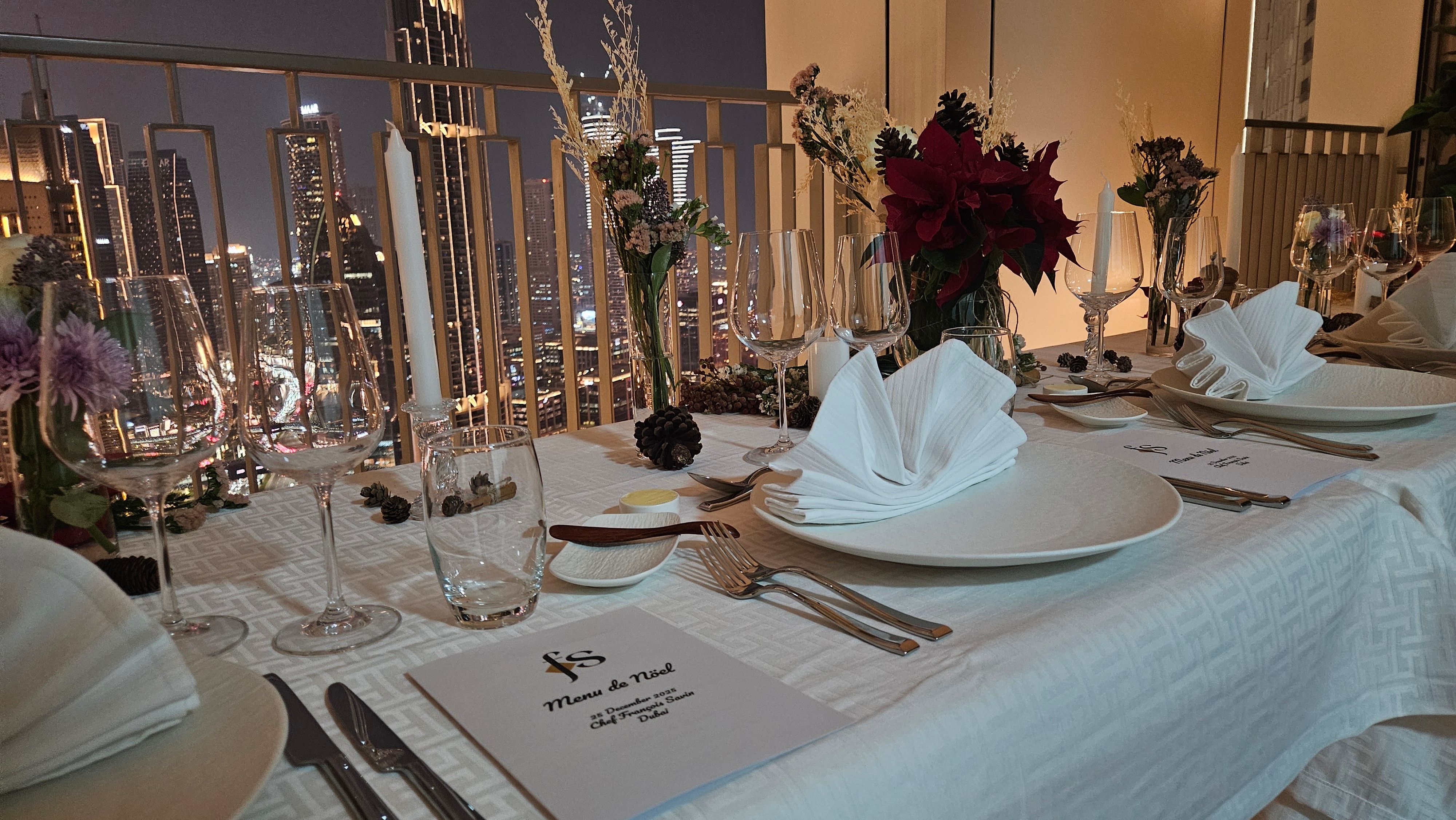 Festive table and tree against the skyline.
