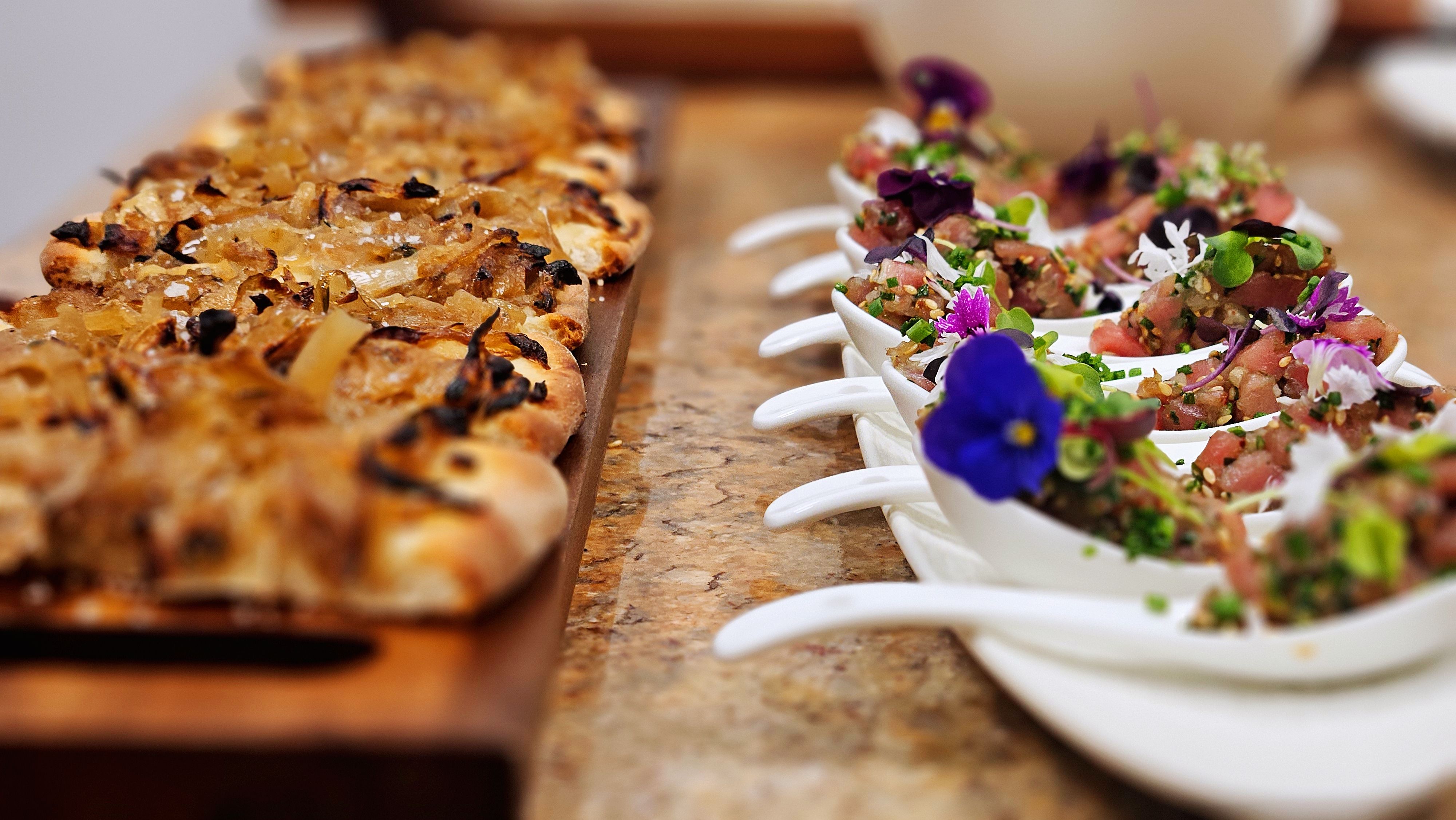 Pissaladière and tartare spoons for a reception.