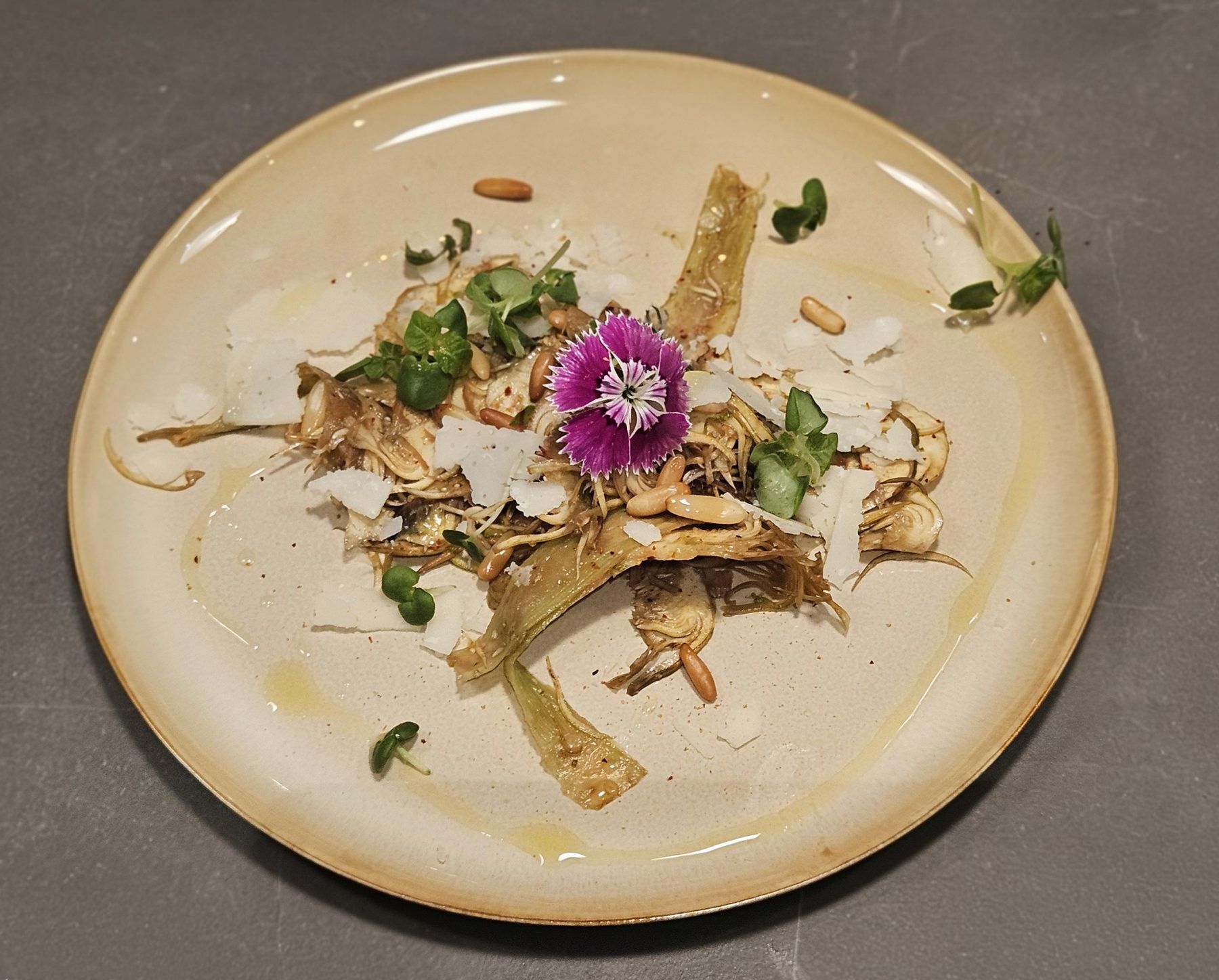 Braised artichokes, parmesan shavings and pine nuts.