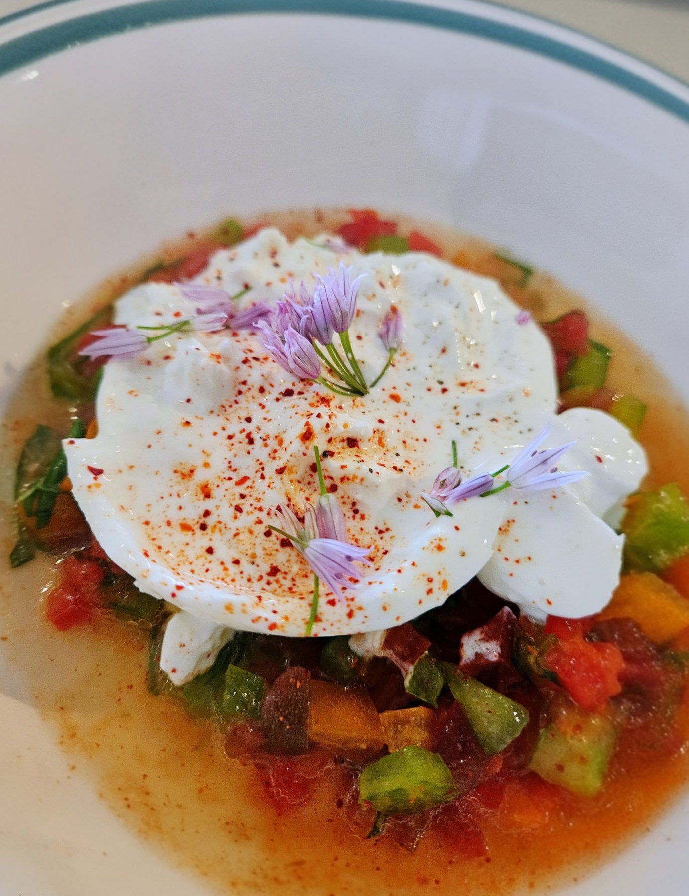 Burrata, tomatoes and chive flowers.